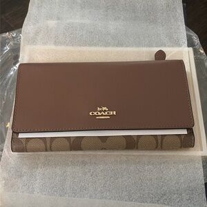 Brand new Coach, wallet with tag and all inserts and protection still inside!